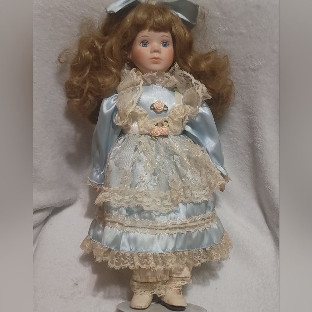 Vintage Porcelain Doll with Blue Lace Dress
